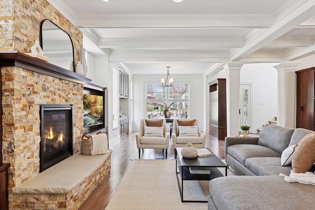 38 Mississippi River Blvd N, Saint Paul, MN 55104 - living area with wood finished floors, beamed ceiling, a stone fireplace, a chandelier, and ornamental molding