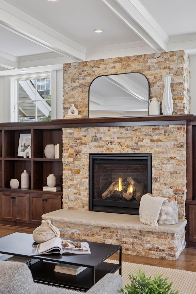 38 Mississippi River Blvd N, Saint Paul, MN 55104 - living area with beam ceiling, wood finished floors, a stone fireplace, and crown molding