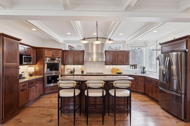 38 Mississippi River Blvd N, Saint Paul, MN 55104 - kitchen with stainless steel appliances, wall chimney range hood, a sink, beamed ceiling, and light wood finished floors