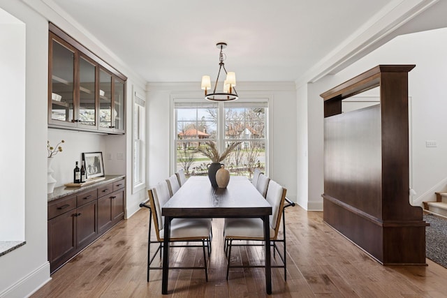 38 Mississippi River Blvd N, Saint Paul, MN 55104 - dining space with a chandelier, stairway, and wood finished floors