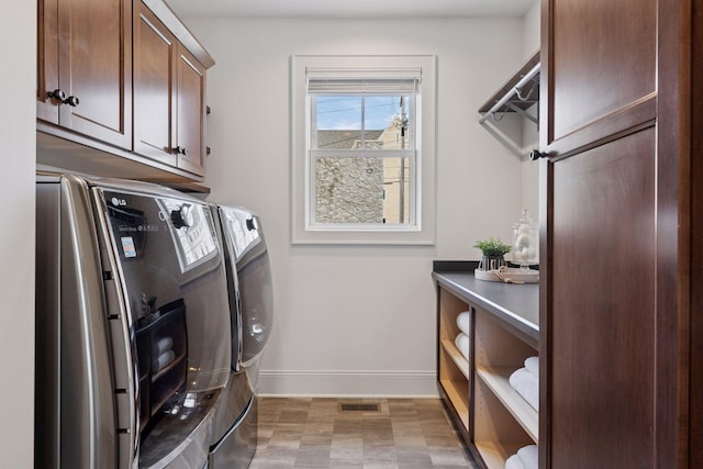 38 Mississippi River Blvd N, Saint Paul, MN 55104 - clothes washing area with cabinet space, washer and clothes dryer, and baseboards