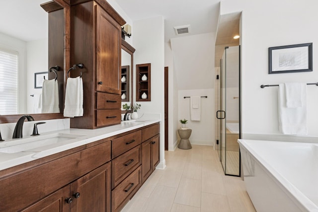 38 Mississippi River Blvd N, Saint Paul, MN 55104 - bathroom featuring a stall shower, a soaking tub, double vanity, and tile patterned flooring