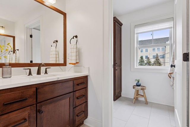 38 Mississippi River Blvd N, Saint Paul, MN 55104 - bathroom with baseboards, vanity, and tile patterned floors