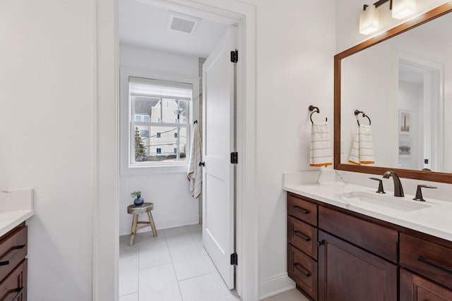 38 Mississippi River Blvd N, Saint Paul, MN 55104 - bathroom featuring vanity, tile patterned floors, and baseboards