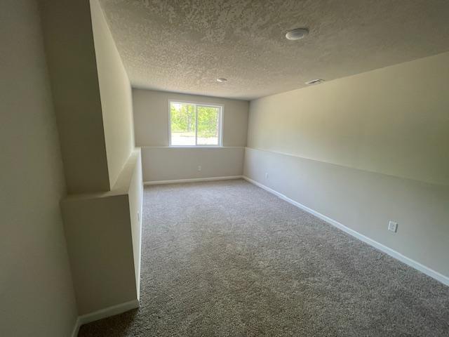 16839 Piper Ln, Brainerd, MN 56401 - carpeted empty room with a textured ceiling and baseboards