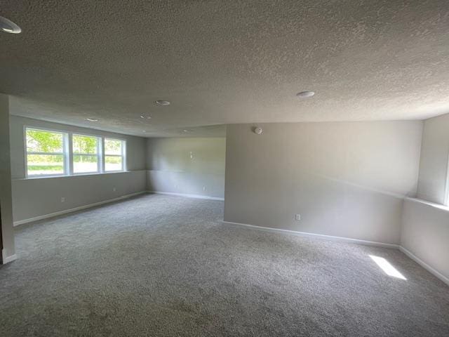 16839 Piper Ln, Brainerd, MN 56401 - unfurnished room featuring carpet, a textured ceiling, and baseboards