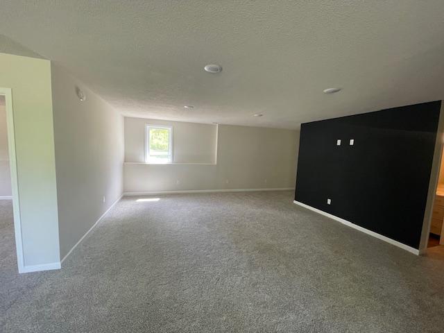 16839 Piper Ln, Brainerd, MN 56401 - spare room with carpet floors, baseboards, and a textured ceiling