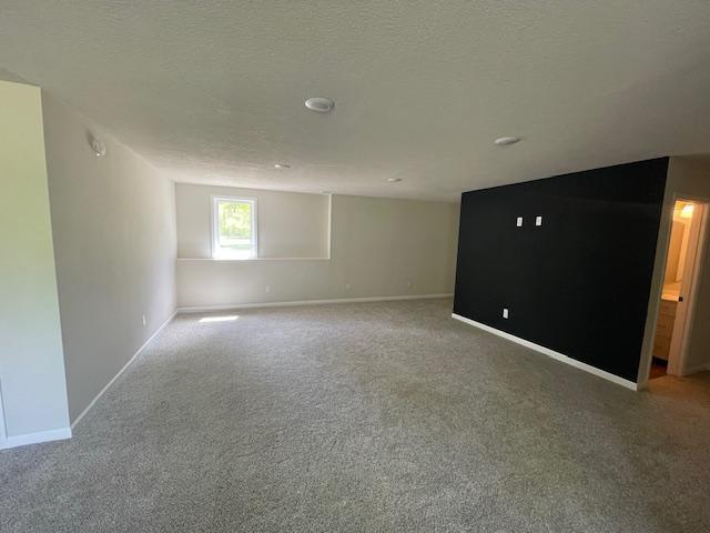 16839 Piper Ln, Brainerd, MN 56401 - carpeted spare room featuring baseboards and a textured ceiling