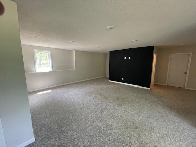 16839 Piper Ln, Brainerd, MN 56401 - carpeted spare room featuring baseboards and a textured ceiling