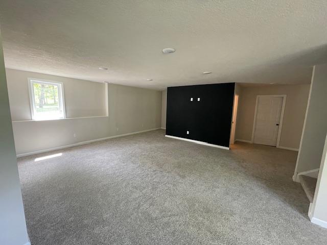 16839 Piper Ln, Brainerd, MN 56401 - carpeted empty room with baseboards and a textured ceiling