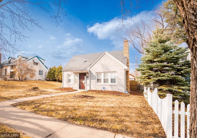 1803 Bush Ave E, Saint Paul, MN 55119 - bungalow featuring a chimney and stucco siding