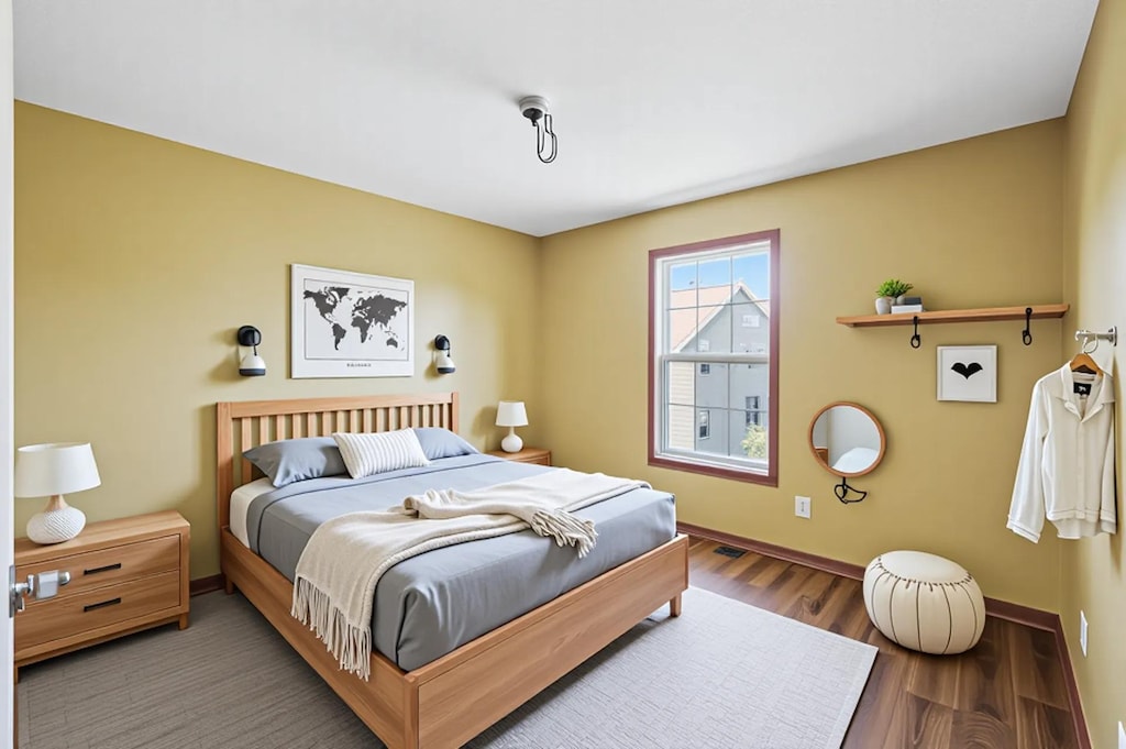 5200 Scott Ct, Robbinsdale, MN 55422 - bedroom with baseboards and wood finished floors