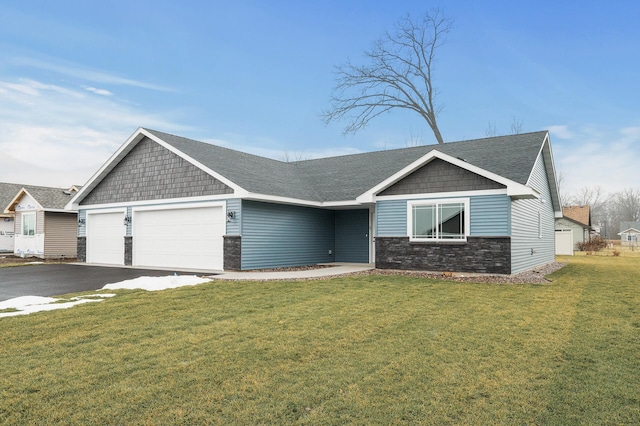 view of front facade featuring aphalt driveway, stone siding, an attached garage, and a front lawn