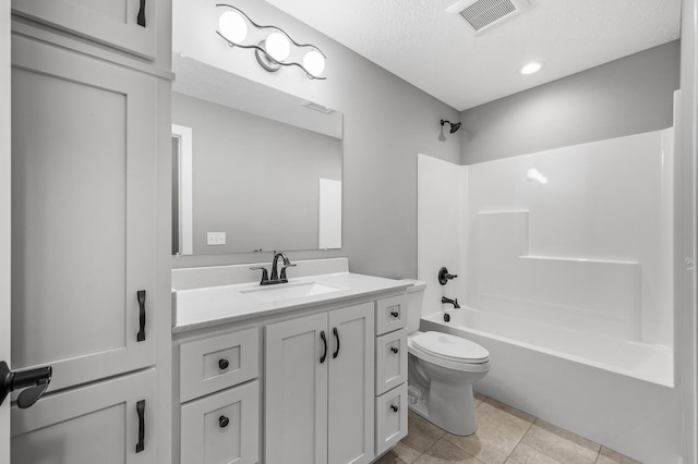 full bathroom with tile patterned floors, visible vents, toilet, shower / washtub combination, and vanity