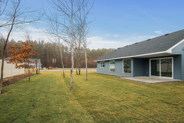 view of yard with a patio and fence