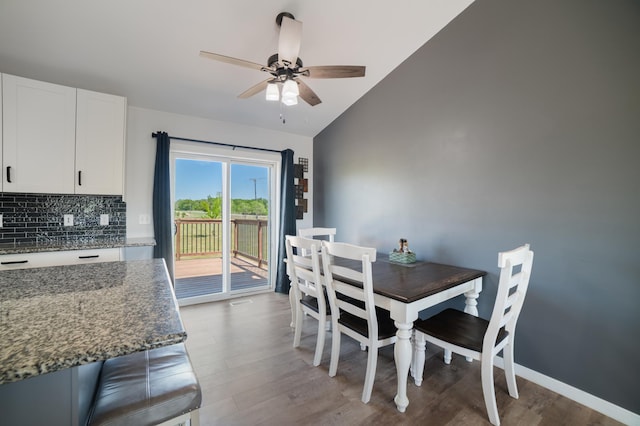 18492 120th St SE, Big Lake, MN 55309 - dining room with a ceiling fan, vaulted ceiling, and light wood finished floors