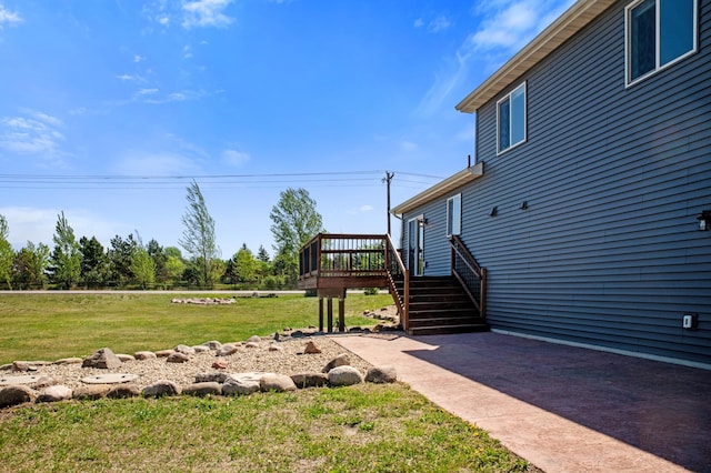 18492 120th St SE, Big Lake, MN 55309 - view of grassy yard featuring a wooden deck, a patio, and stairway