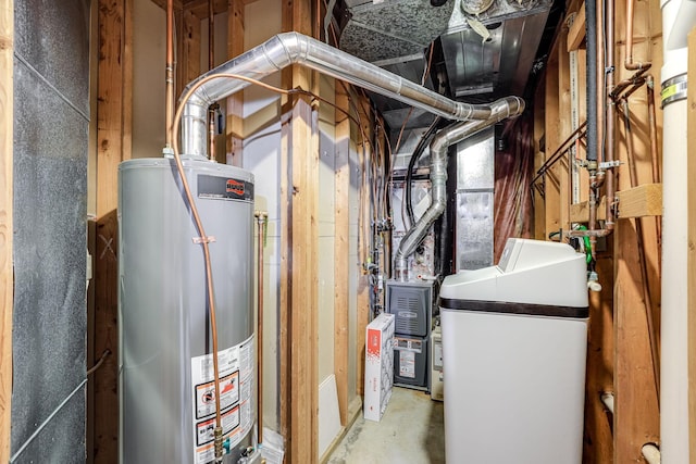 utilities featuring gas water heater and washer / clothes dryer