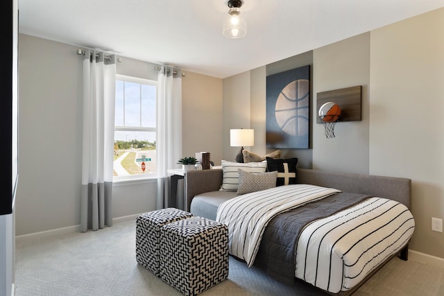 carpeted bedroom featuring baseboards