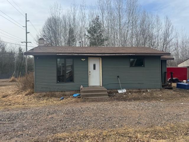 view of front of home with a chimney