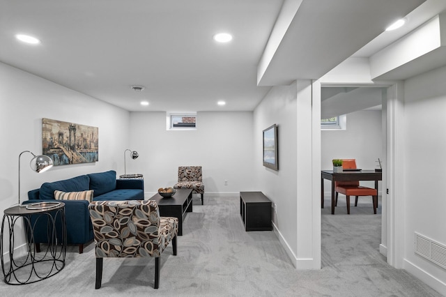 living room featuring recessed lighting, visible vents, baseboards, and light colored carpet