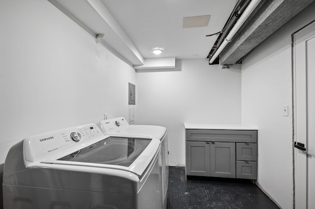 laundry area with cabinet space and separate washer and dryer