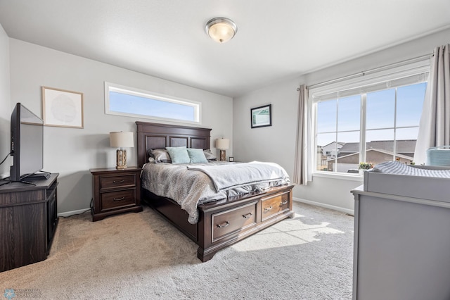 carpeted bedroom featuring baseboards