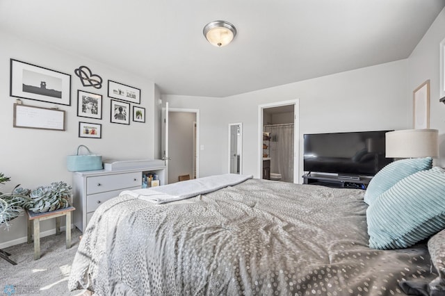 bedroom with baseboards and carpet floors