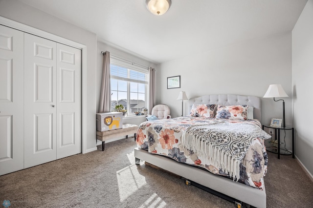 bedroom featuring a closet, carpet floors, and baseboards