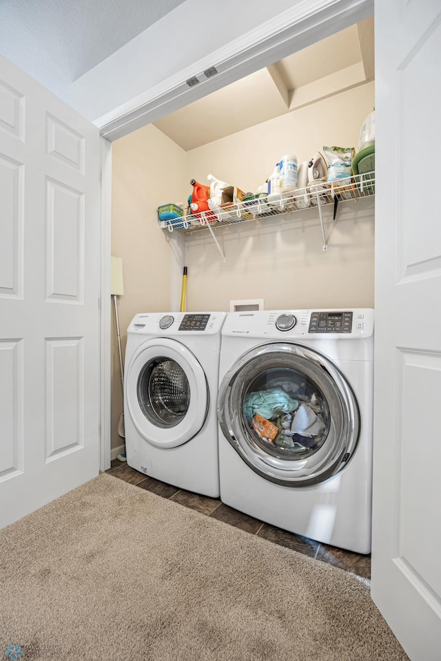 clothes washing area featuring laundry area, washer and dryer, and visible vents