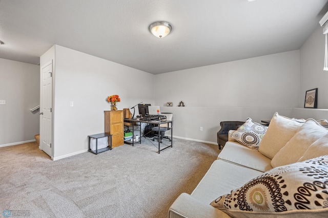 carpeted home office with baseboards