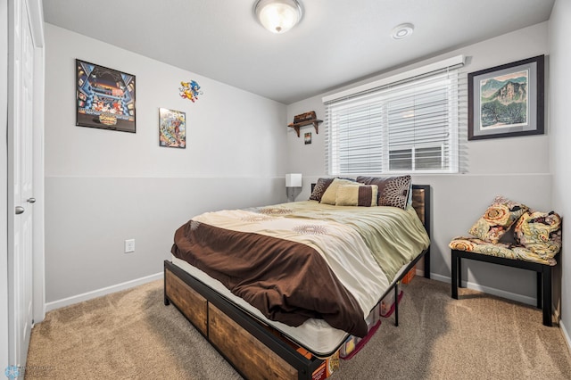 bedroom with carpet flooring and baseboards