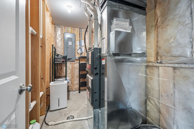 utility room with electric panel and heating unit