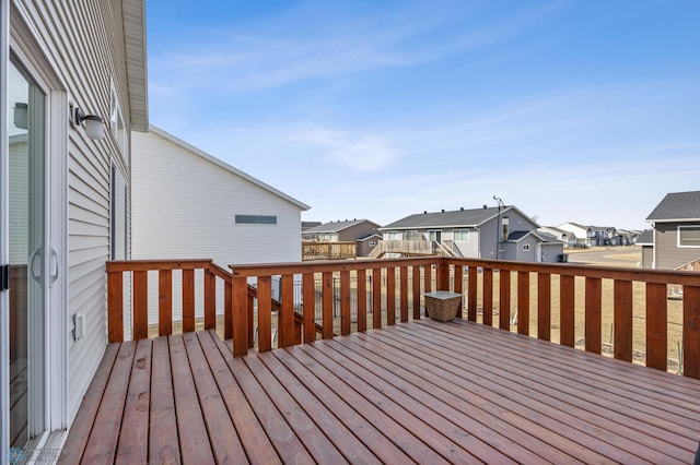 wooden deck with a residential view