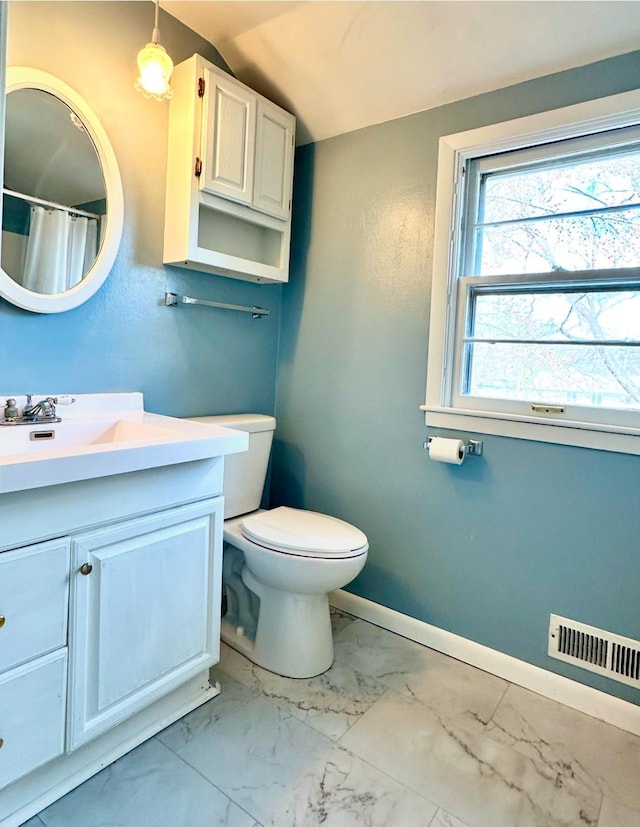 bathroom featuring visible vents, baseboards, toilet, marble finish floor, and vanity