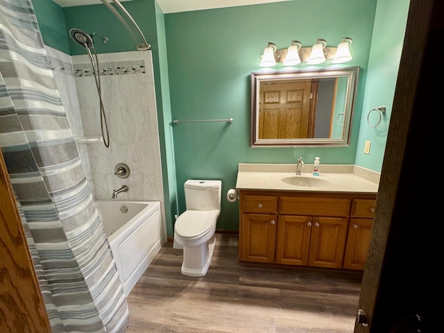 full bathroom with vanity, shower / tub combo, toilet, and wood finished floors