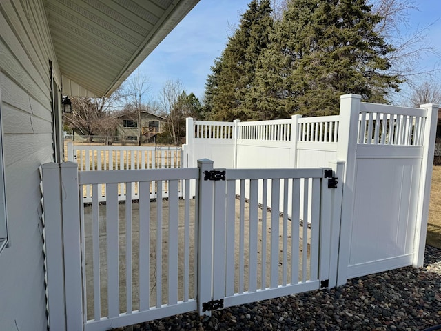 view of gate with fence