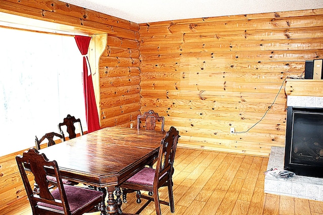 12170 Hillcrest Ct SE, Becker, MN 55308 - dining room with light wood-style flooring and log walls