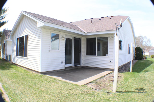 12170 Hillcrest Ct SE, Becker, MN 55308 - rear view of property with roof with shingles, a patio, and a yard