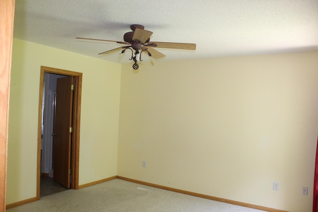 12170 Hillcrest Ct SE, Becker, MN 55308 - unfurnished room with light carpet, ceiling fan, and a textured ceiling