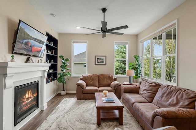 6627 133rd St, Savage, MN 55378 - living area featuring ceiling fan, healthy amount of natural light, wood finished floors, a fireplace, and recessed lighting