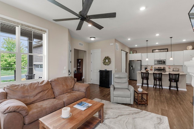 6627 133rd St, Savage, MN 55378 - living area featuring dark wood-style floors, ceiling fan, and recessed lighting