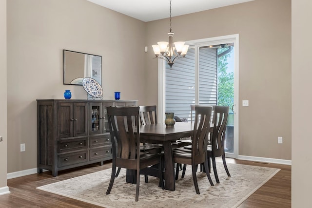 6627 133rd St, Savage, MN 55378 - dining space with a chandelier, baseboards, and wood finished floors