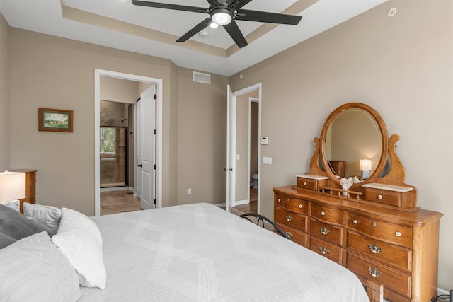 6627 133rd St, Savage, MN 55378 - bedroom with a tray ceiling, ceiling fan, and ensuite bath