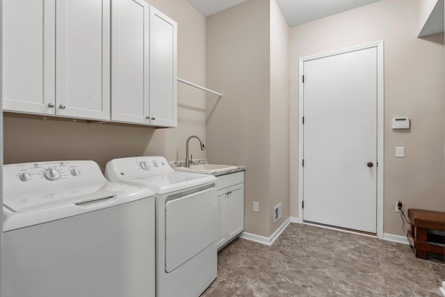 6627 133rd St, Savage, MN 55378 - laundry area featuring washer and dryer, cabinet space, and baseboards