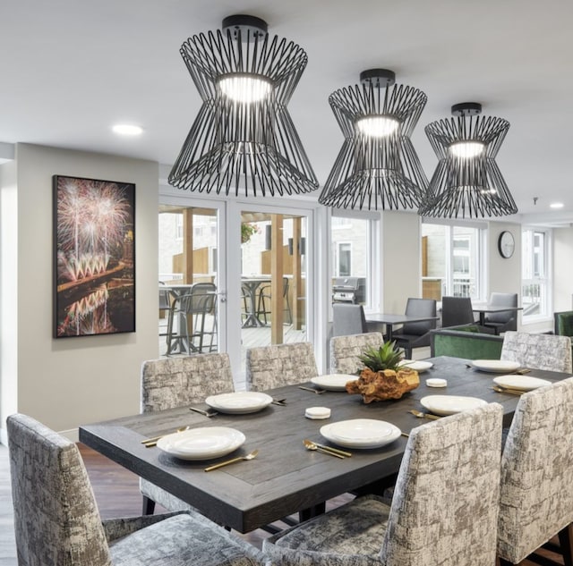 dining area featuring plenty of natural light, recessed lighting, and wood finished floors