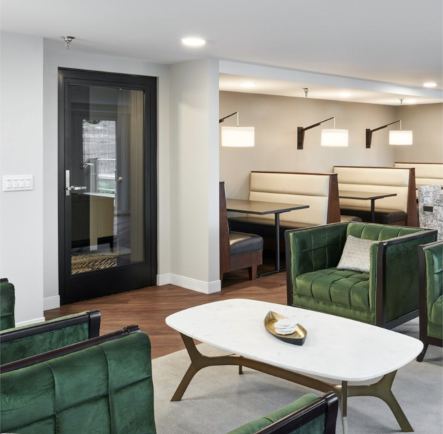 living room with recessed lighting, baseboards, and wood finished floors