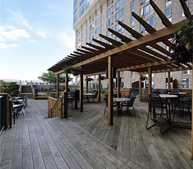 deck featuring outdoor dining space and a pergola