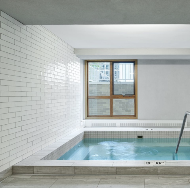 view of swimming pool with an indoor in ground hot tub