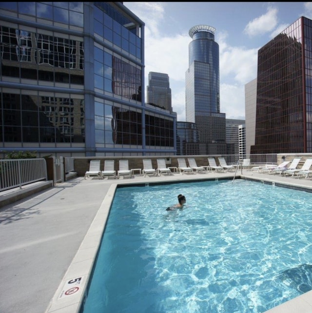 community pool featuring a city view